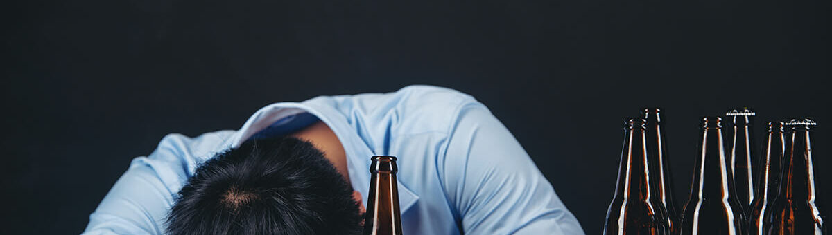 man drinking a lot of beers