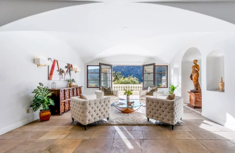 eautiful, modern sitting area with four large chairs, a red marble sculpture, and views onto the Hollywood Hills at Legacy's Los Angeles rehab