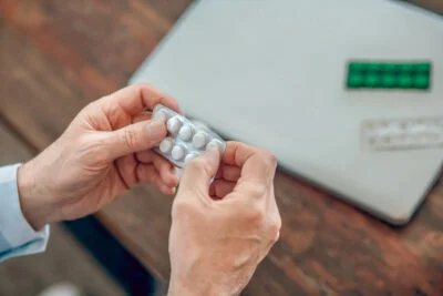 A Man going through his pills