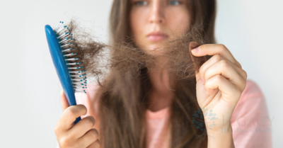 woman experiencing hair loss